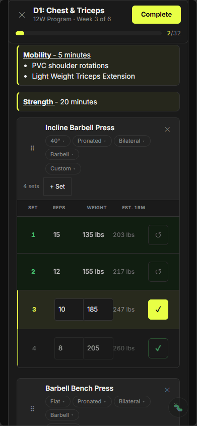 Inline mobility and strength cues sit right on the movement while every set/rep/weight card stays editable with a live est. 1RM. A 2-of-32 completion bar tracks the session and the volt Complete button closes it out — no menu-diving between sets.